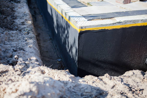 Professional Interior Drainage System technician working in Roslyn, NY